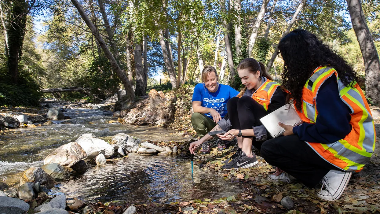 Jennifer Alford (left), chair of CSUSB’s Department of Geography and Environmental Studies and the director of the Institute for Watershed Resiliency, out in the field with students including Emilie Martin (center) at Lytle Creek.