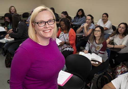 Professor and classroom explore graduate programs.