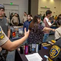 students speaking with CSUSB police