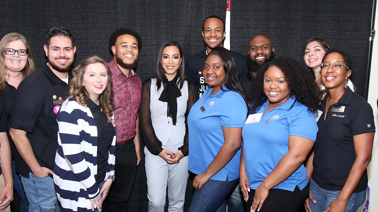 Angela Rye (center, wearing the black bow) with some of the staff from the CSUSB Office of Student Engagement