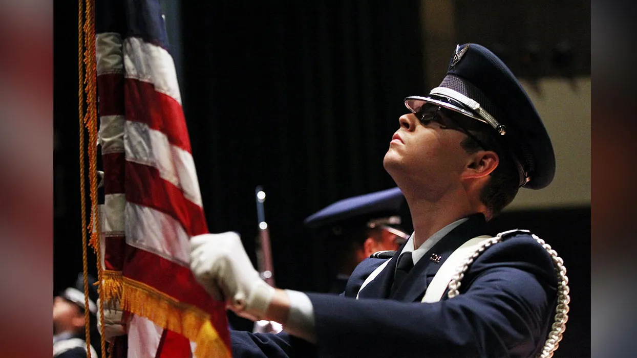 Soldier holding flag.