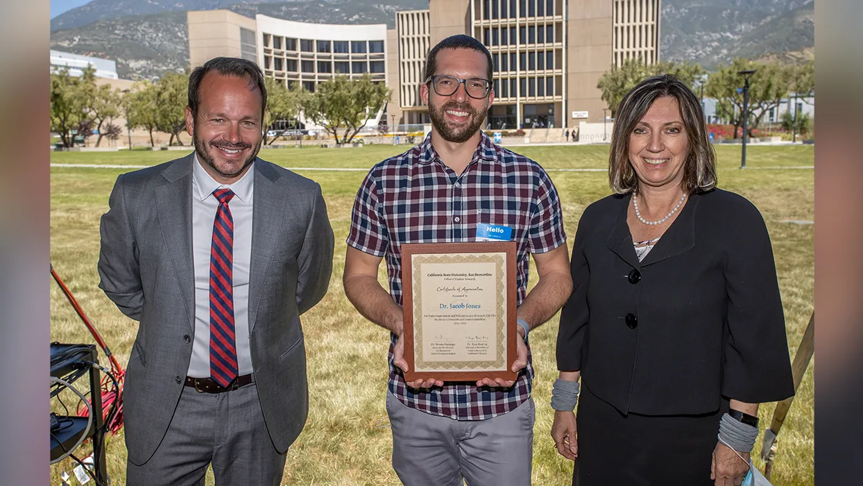 Ryan Keating, director of the Office of Student Research and professor of history; Jacob Jones, associate professor of psychology and one of the four awardees; and Dorota Huizinga, dean of Graduate Studies and the Office of Student Research