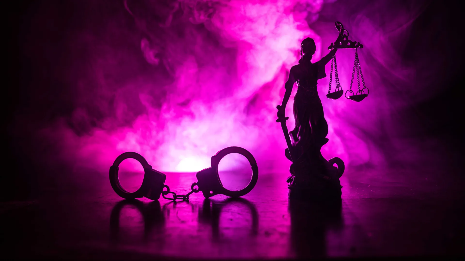 Criminal justice illustration: handcuffs and scales of justice