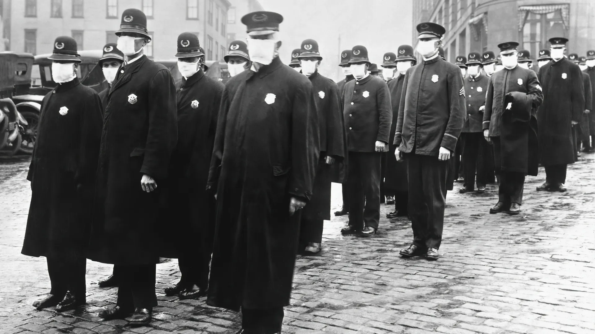 Policemen in Seattle wearing masks made by the Red Cross, during the influenza epidemic of 1918, in December 1918.