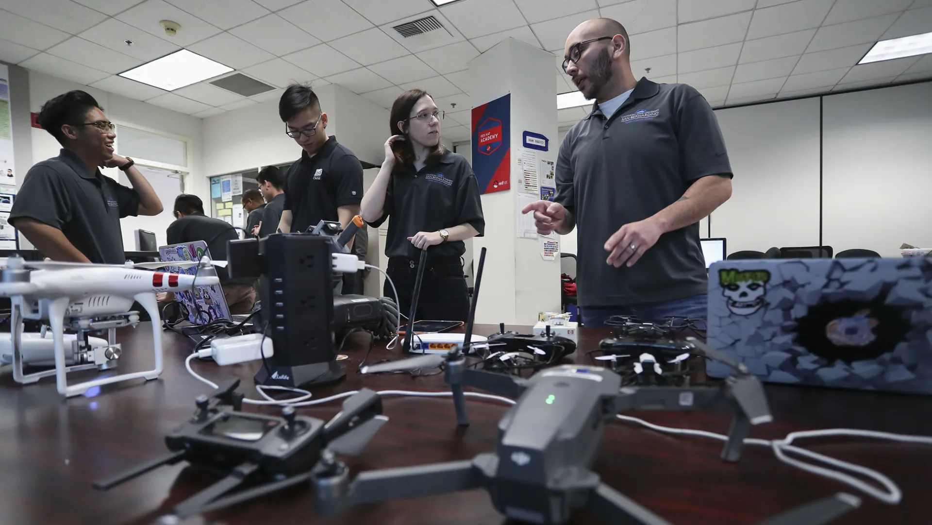 CSUSB students in the university’s Cybersecurity Center working with drones.