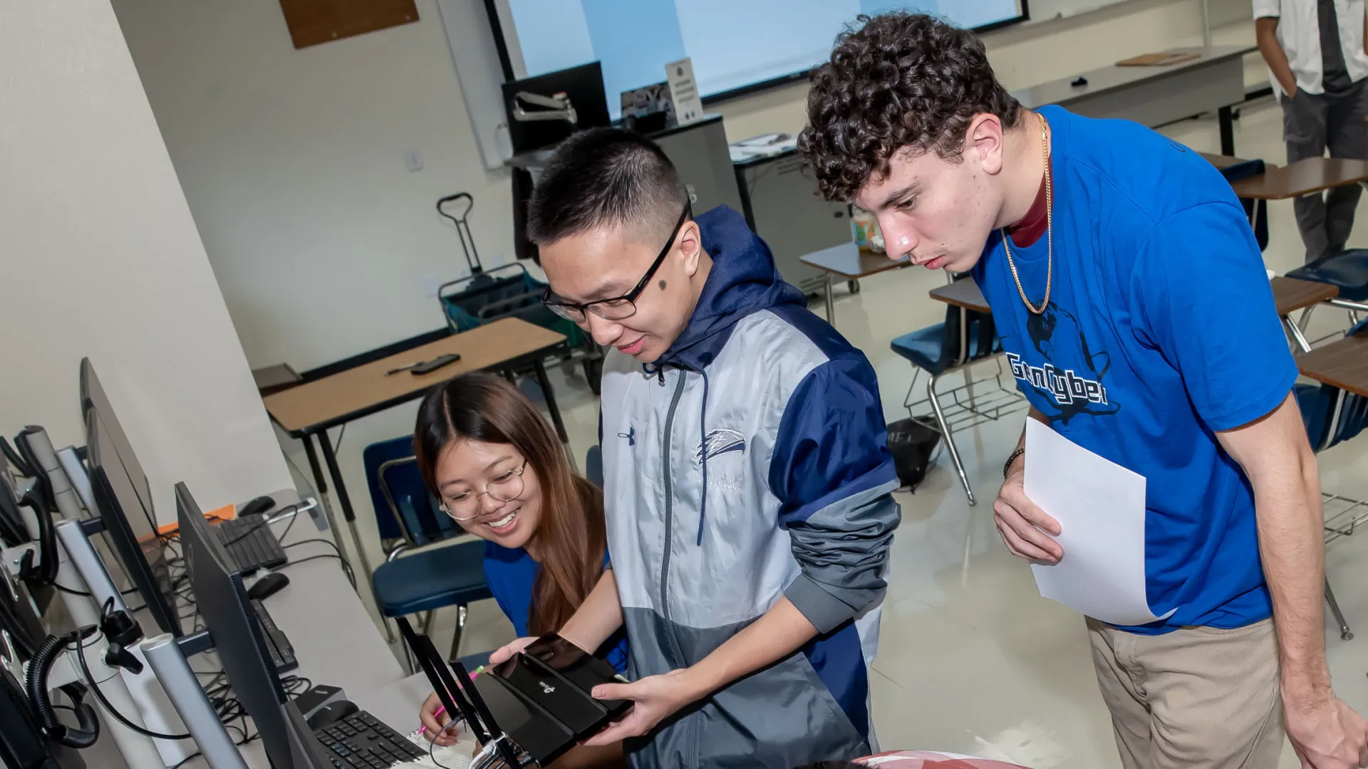 Students and camp instructors look over equipment at the recent GenCyber Summer Day Camp at CSUSB.