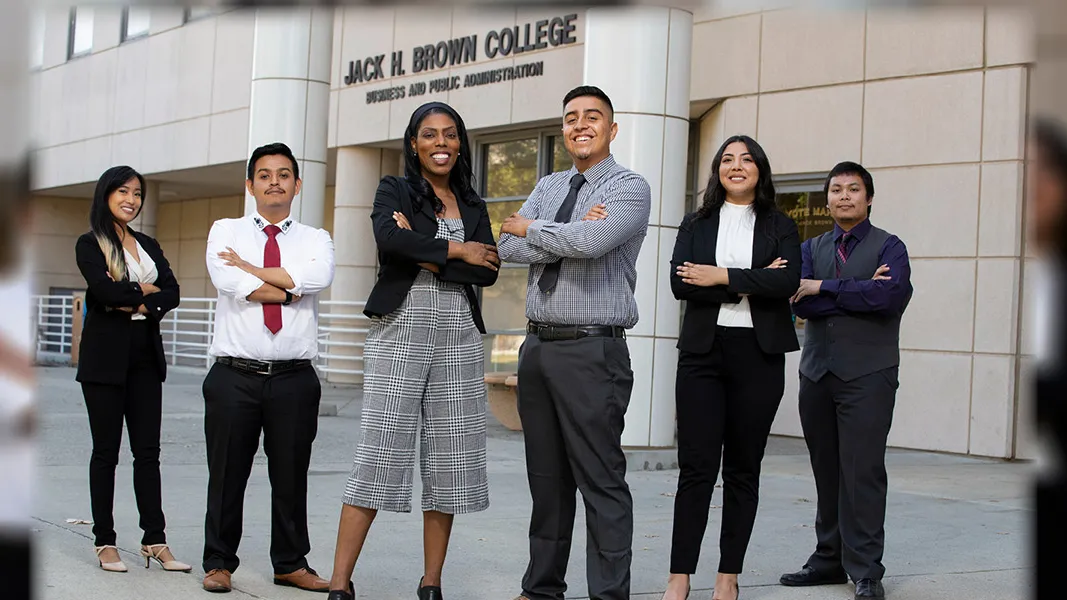 Group of students in front of Jack H. Brown College of Business and Public Administration building.