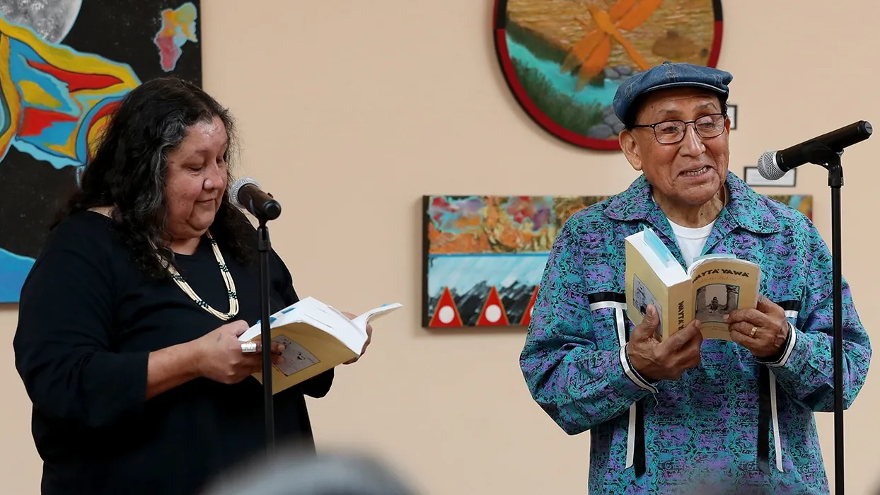 Carolyn Horsman (left) and Ernest Siva, elder of Morongo Band of Mission Indians, at the annual Native Voices Poetry Festival at the Dorothy Ramon Learning Center in Banning in February.
