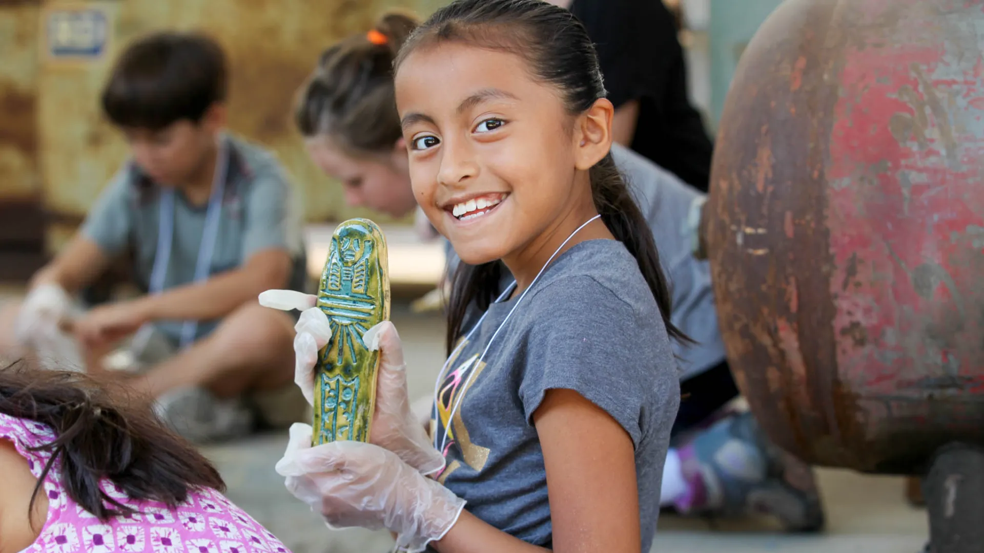 Girl participating in RAFFMA's Kids Discover Egypt Workshop.