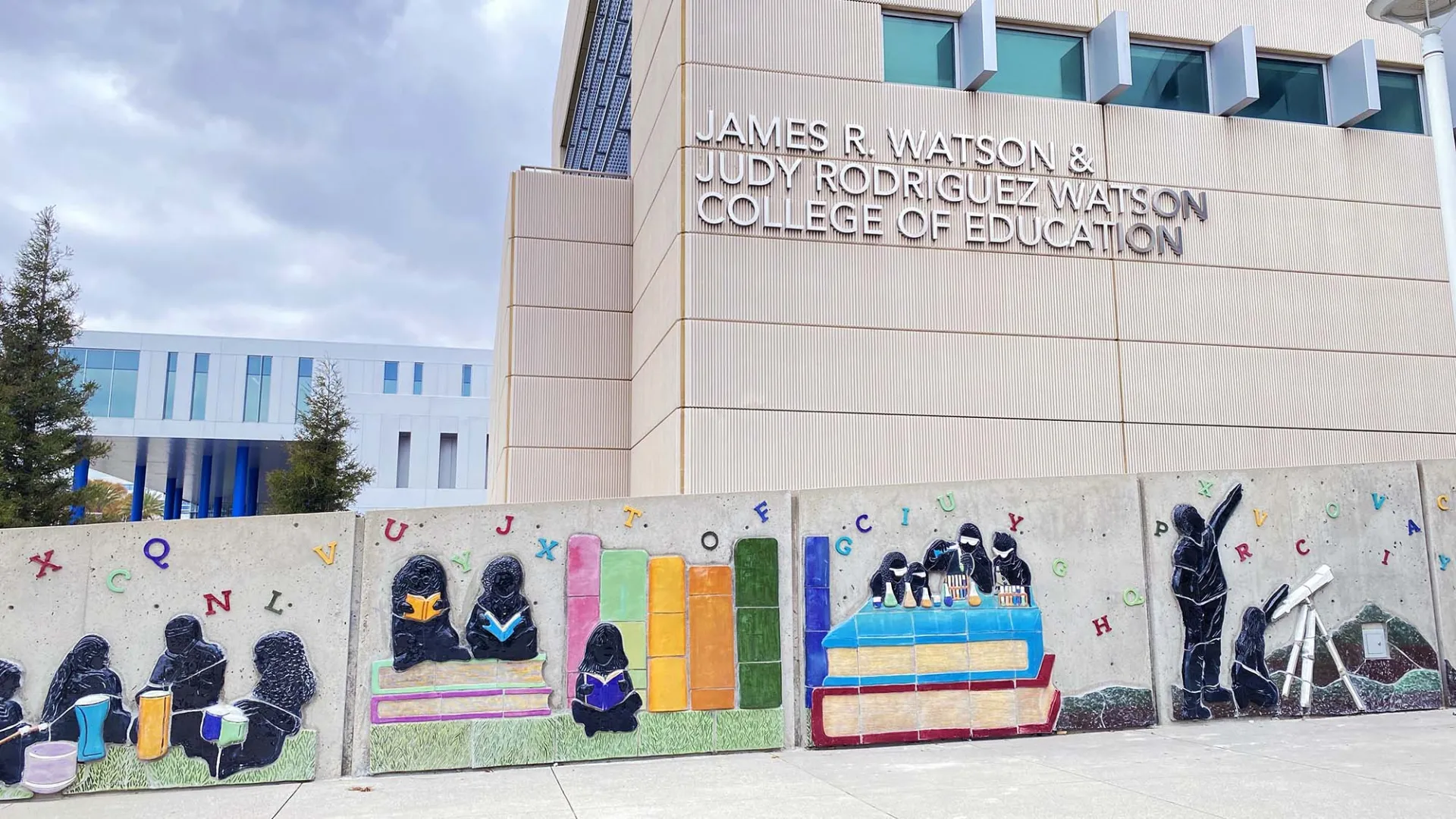 Part of the mural “Eternal Learning” in front of the James R. Watson and Judy Rodriguez Watson College of Education.