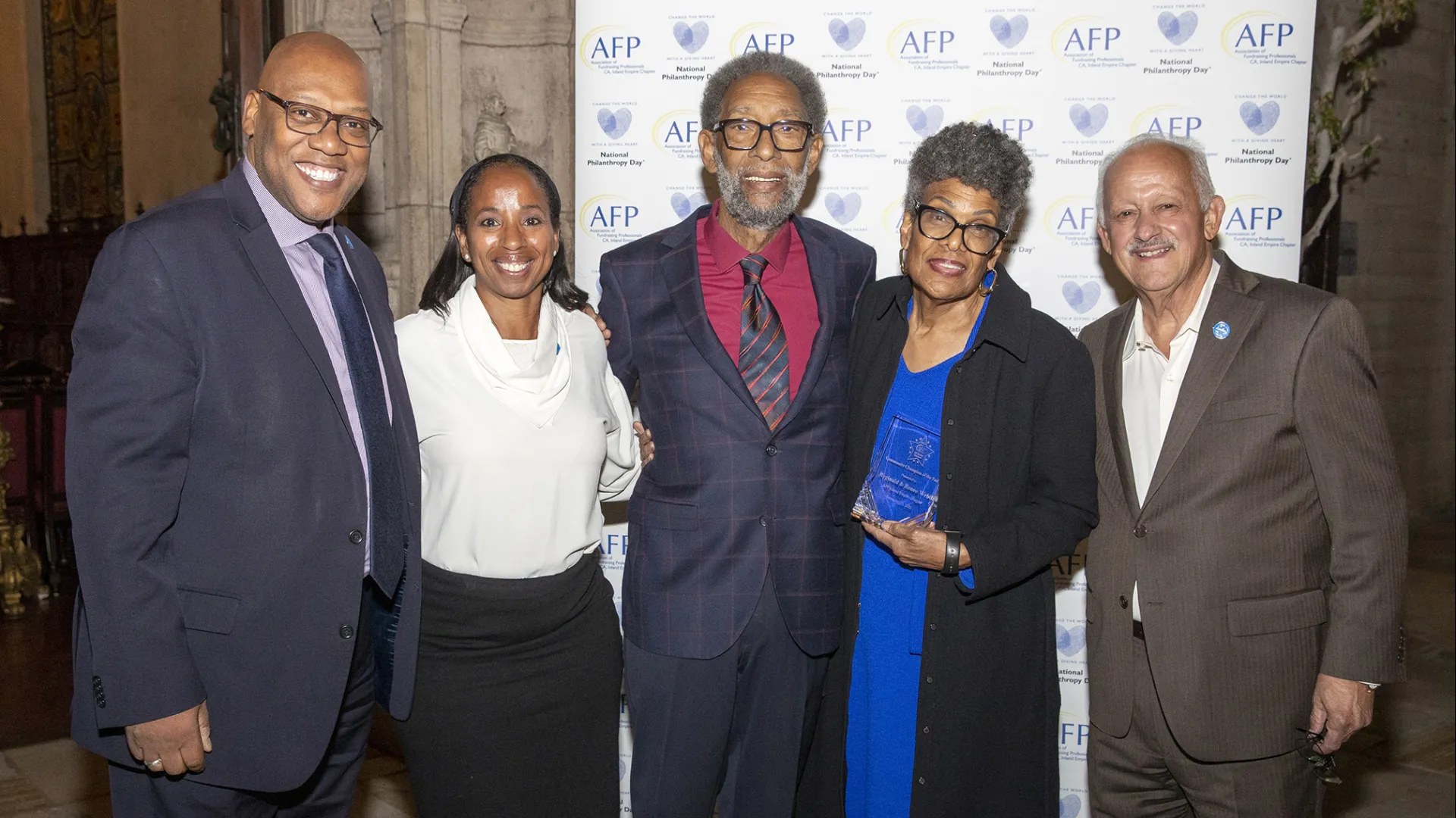 From left: Adrian Stevens, CSUSB associate vice president philanthropic giving; Nefertiti Long, vice chair CSUSB Philanthropic Foundation board, 2022 Community Champions of the Year Reggie Webb and René Webb; CSUSB President Tomás D. Morales.