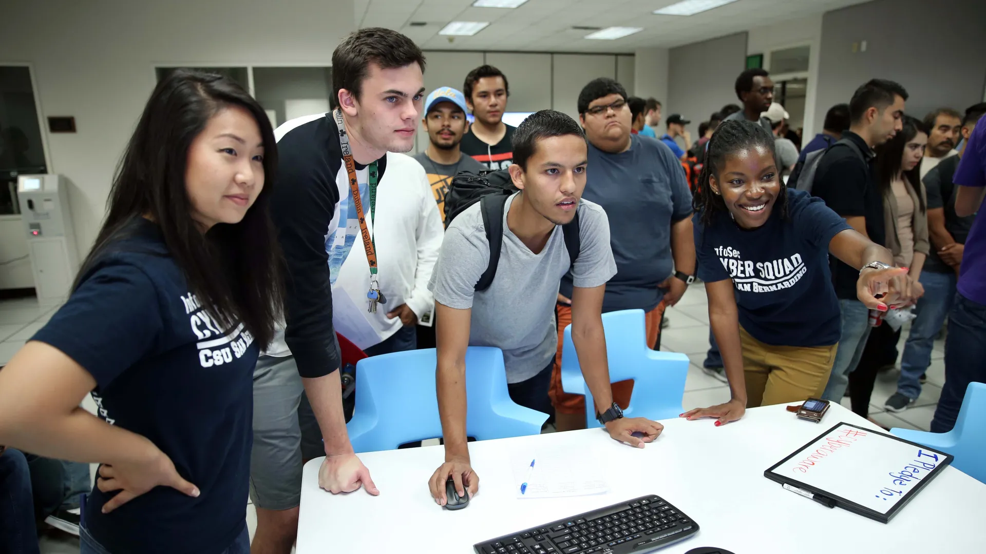 Students at an open house event by the CSUSB Cybersecurity Center. The Department of Defense Cyber Scholarship Program (DoD CySp) has awarded three full scholarships to students in the CSUSB cybersecurity program.
