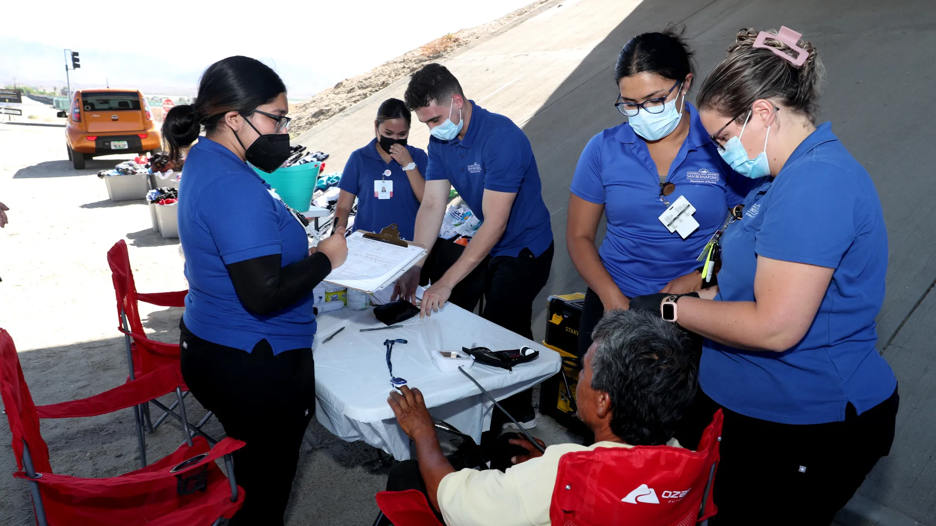 The CSUSB Nursing Street Medicine team assisting community members in the Coachella Valley.