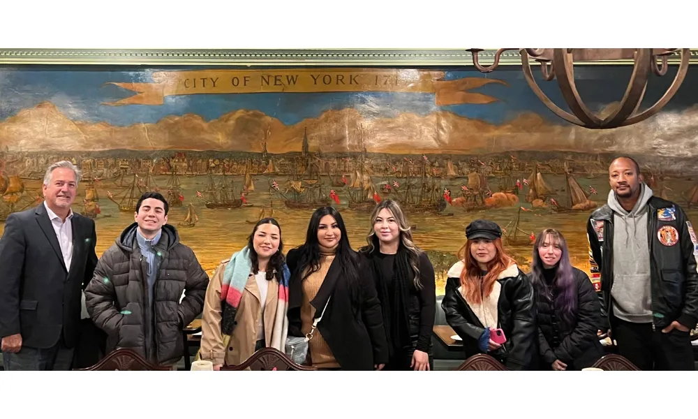 Students posing for a photo in NYC in various casual wear