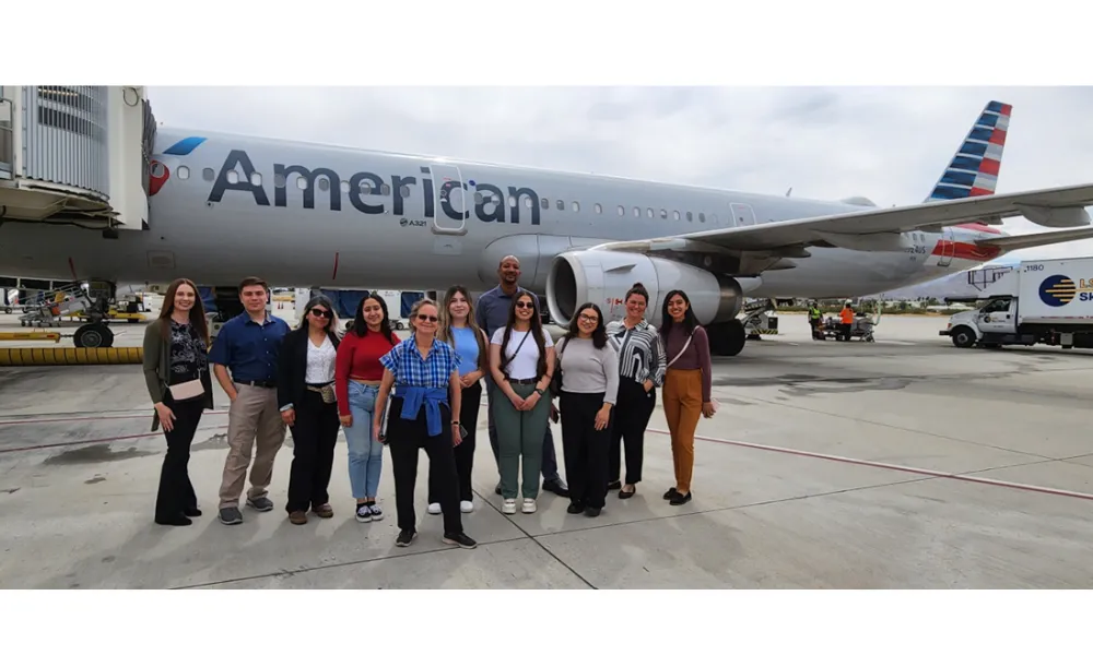 Students and faculty with American Airlines Airplane