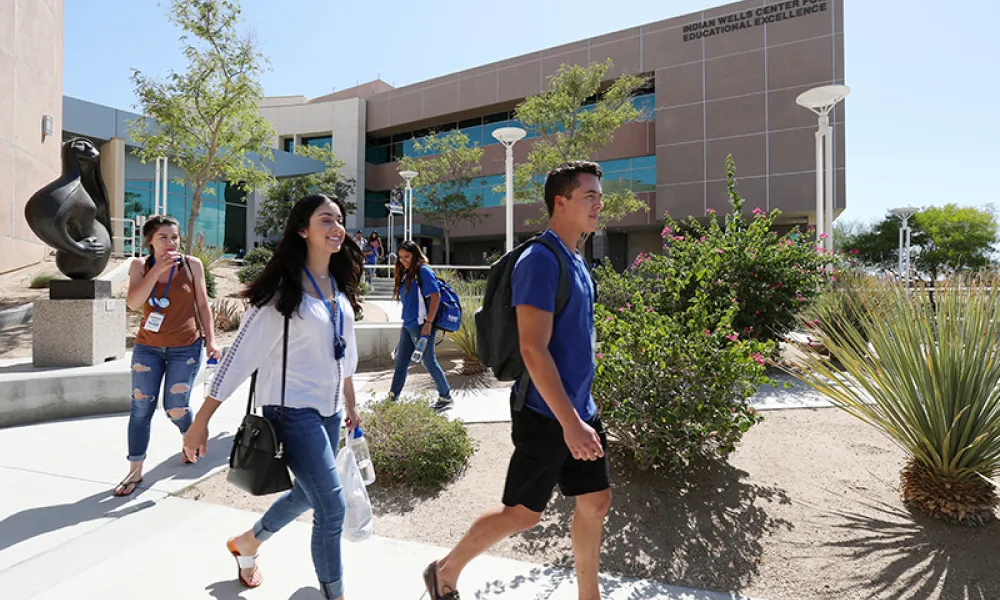 csusb students walking in front of building