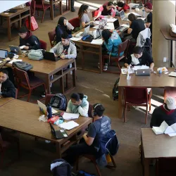 Students studying in the Pfau Library.