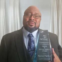 Patrick Marshall, CSUSB alumnus and inmate rehabilitation manager for Santa Clara County Sheriff's Office, with the 2024 Equity and Social Justice: Change Agent Award.
