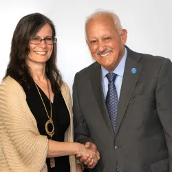 CSUSB President Tomás D. Morales congratulates Gisela Bichler, professor of criminal justice, on being honored with CSUSB’s 2023-2024 Outstanding Professor Award.