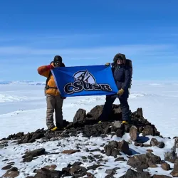 College of Natural Sciences’ students, Jacob Baker and Karina Ramirez, display Coyote Pride while on a research expedition to the Antarctica.