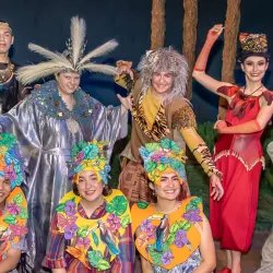 The cast of CSUSB's “Anansi’s Carnival Adventure” posing in their colorful costumes and masks.