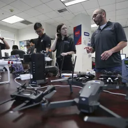 CSUSB students in the university’s Cybersecurity Center working with drones.