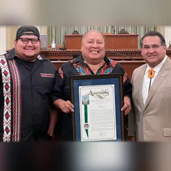 From left, Robert Levi III, Robert Levi Jr., and Assemblymember James Ramos.