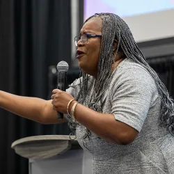 Kim Carter speaking on stage during CSUSB’s Womxn’s Leadership Conference on March 22. 