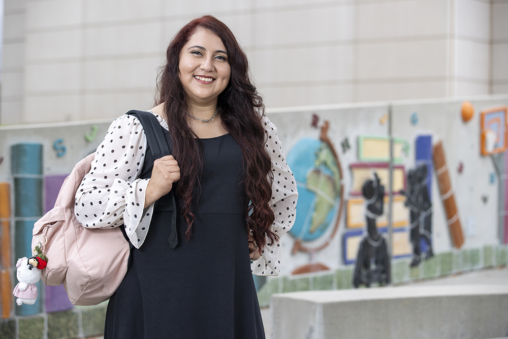 For Marilyn Monroy, the “Eternal Learning” mural outside of the James R. Watson and Judy Rodriguez Watson College of Education, featuring two little boys, reinforces her drive to succeed for her children. 