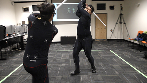 2 men in motion capture suits 