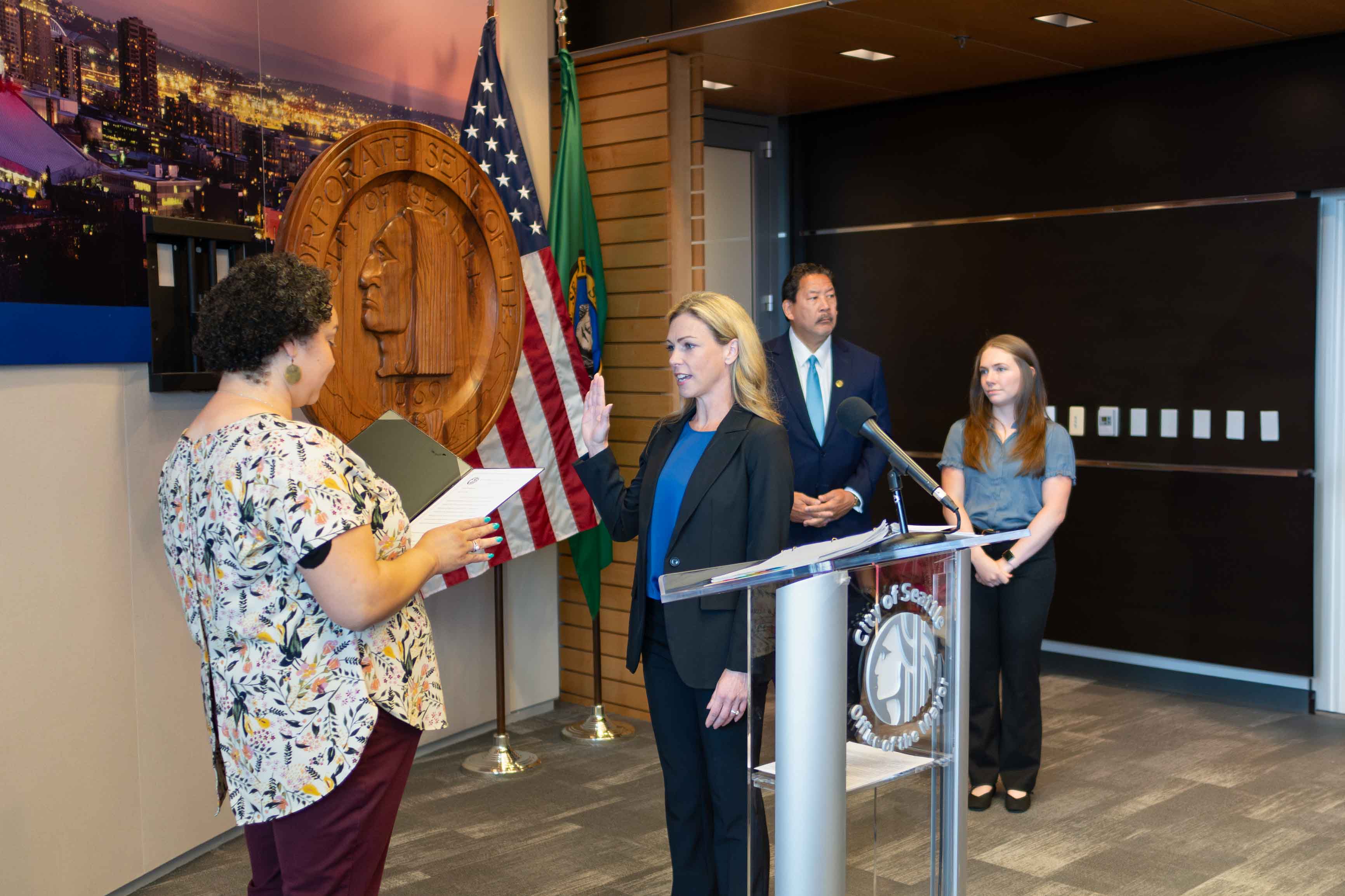 Chief Barden is sworn in as chief of the new CARE program as the Seattle mayor looks on.