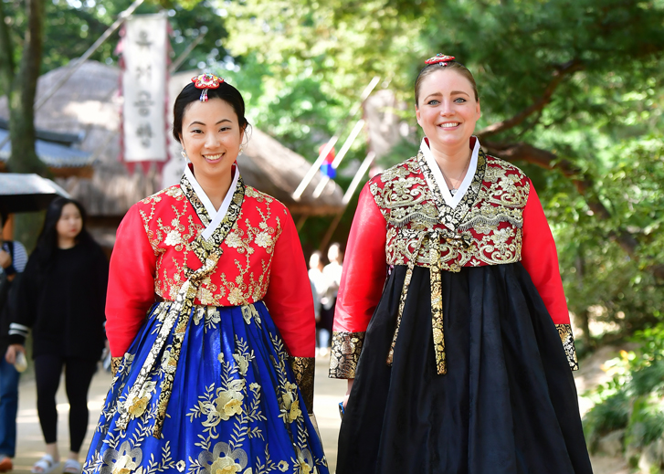 American Student smiling in traditional Korean attire.