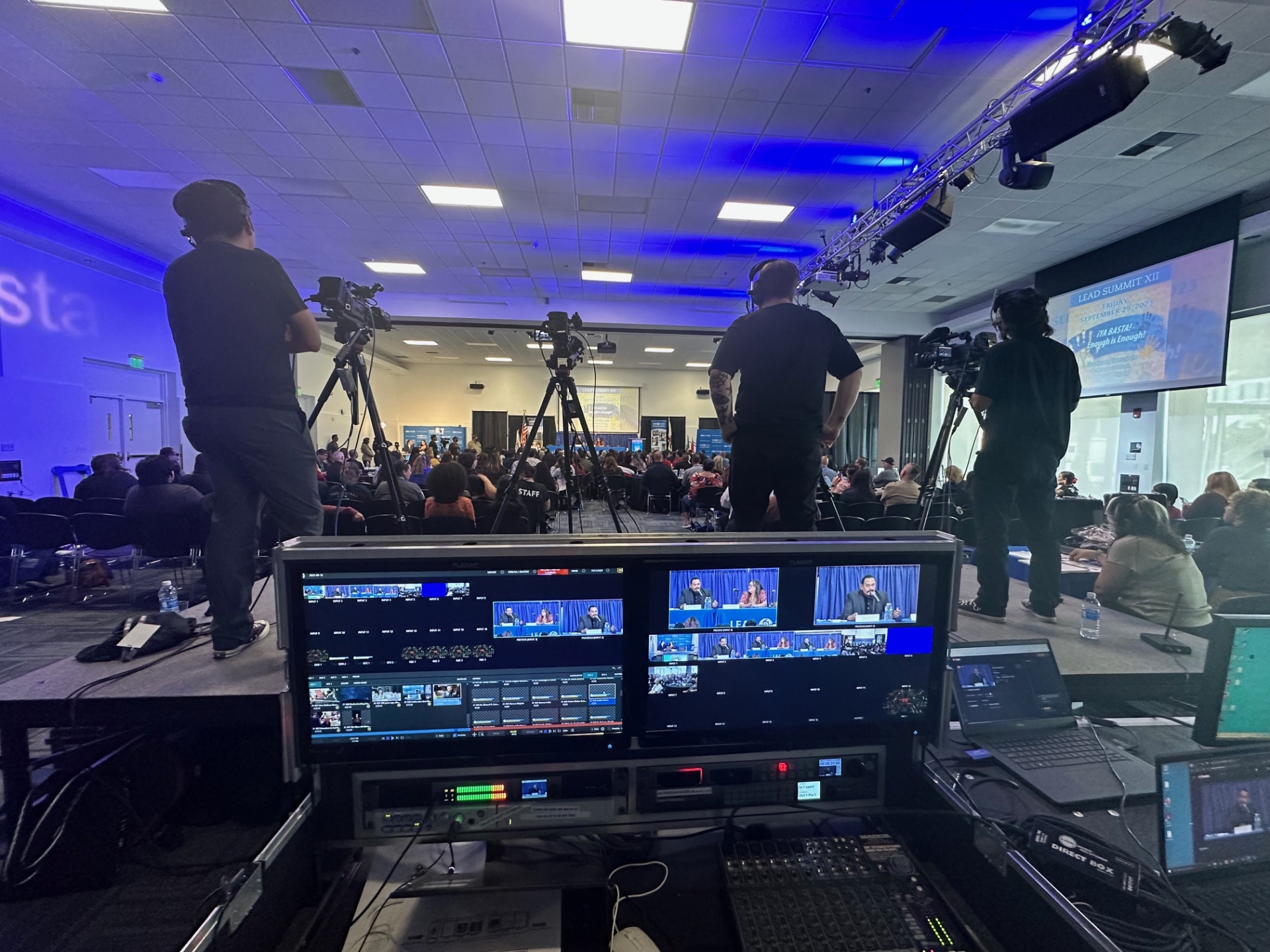 Camera operators and prodcution switcher recording an event 