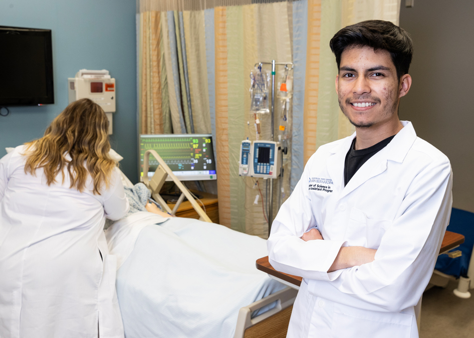 Physician Assistant student smiling in a clinical setting