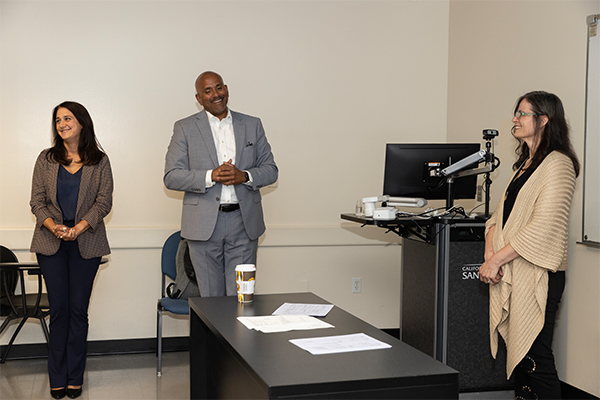 From left, Christina Hassija, dean of the College of Social and Behavioral Science; Rafik Mohamed, provost and vice president of Academic Affairs; and Gisela Bichler, recipient of the university’s 2023-24 Outstanding Professor Award.