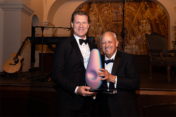 On Dec. 7, CSUSB President Tomás D. Morales (left) presented Chad Mayes, who represented California's 42nd Assembly District from 2014 through 2022, an award for his service to the university.