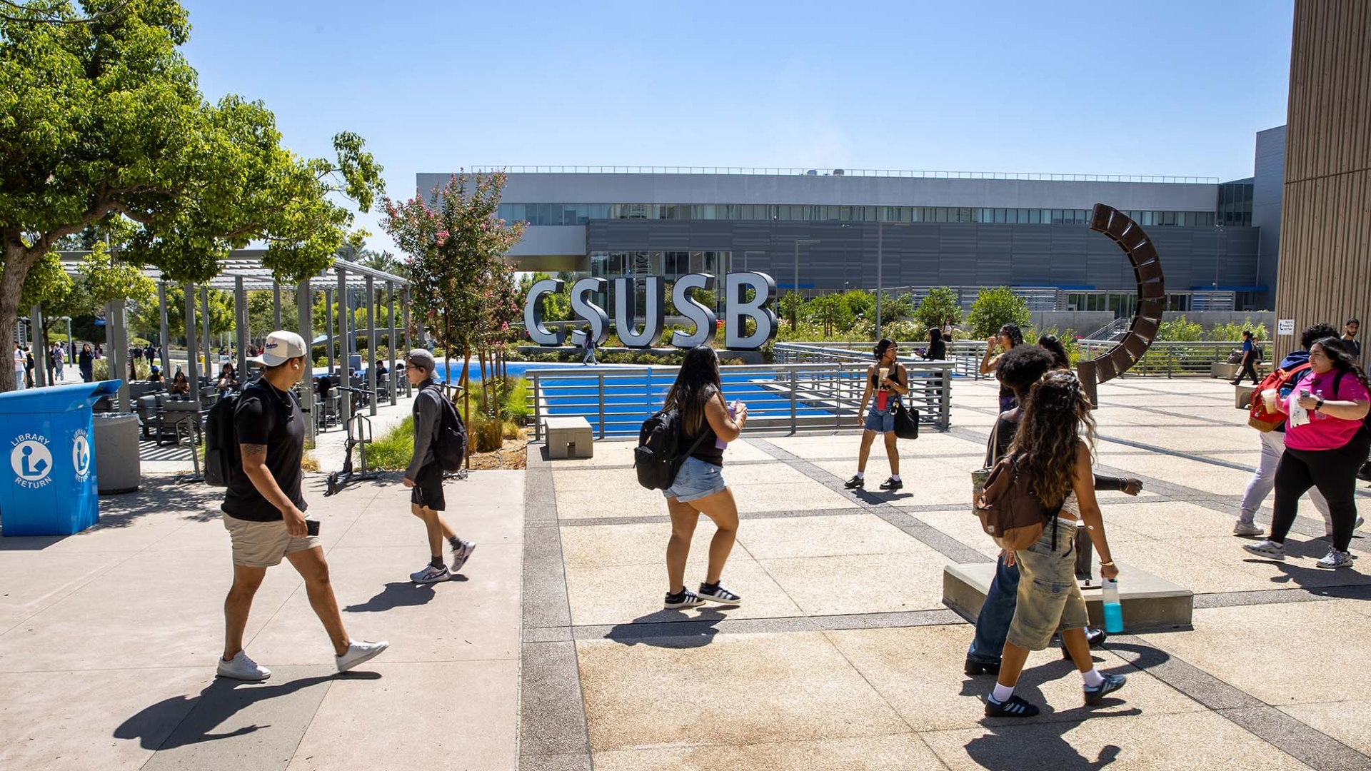 Students make their way to and from the John M. Pfau Library with the CSUSB letters in the background. The Wall Street Journal’s 2025 rankings listed the university at No. 27 in its Student Experience category.