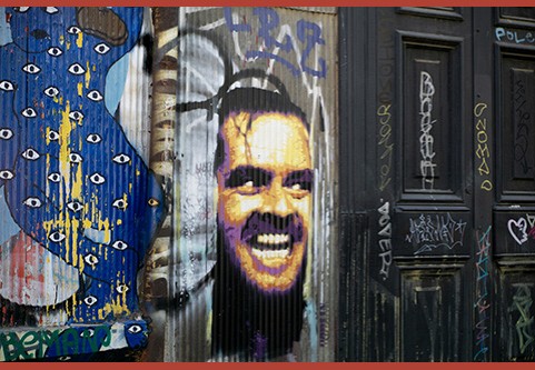 A graffiti mural featuring Jack Nicholson’s grimacing face coming through the wall as in the movie, The Shining.