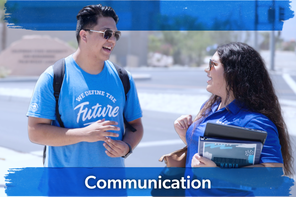 Two people smiling and chatting outdoors. One wears a blue t-shirt saying "We Define the Future," the other holds a folder. Text reads "Communication."