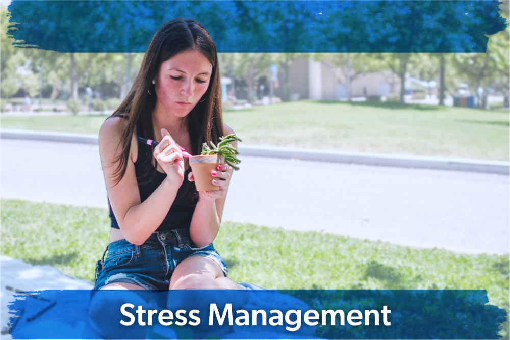 Young woman sits outdoors on grass, holding a yogurt parfait. She appears focused and relaxed. Text overlay reads "Stress Management."