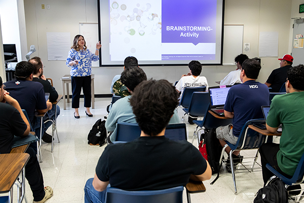 Maggie Boyraz, associate professor, teaching a management class on Oct. 24.