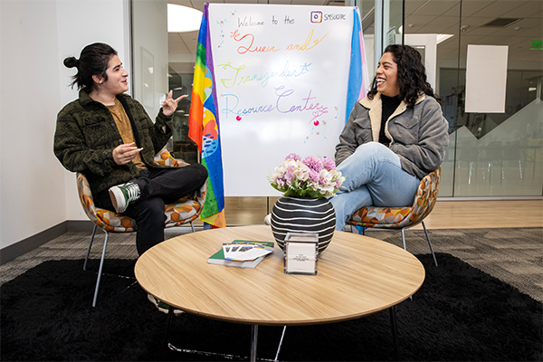 Erick Herrera, a senior double-majoring in sociology and ethnic studies, talking with a CSUSB classmate.