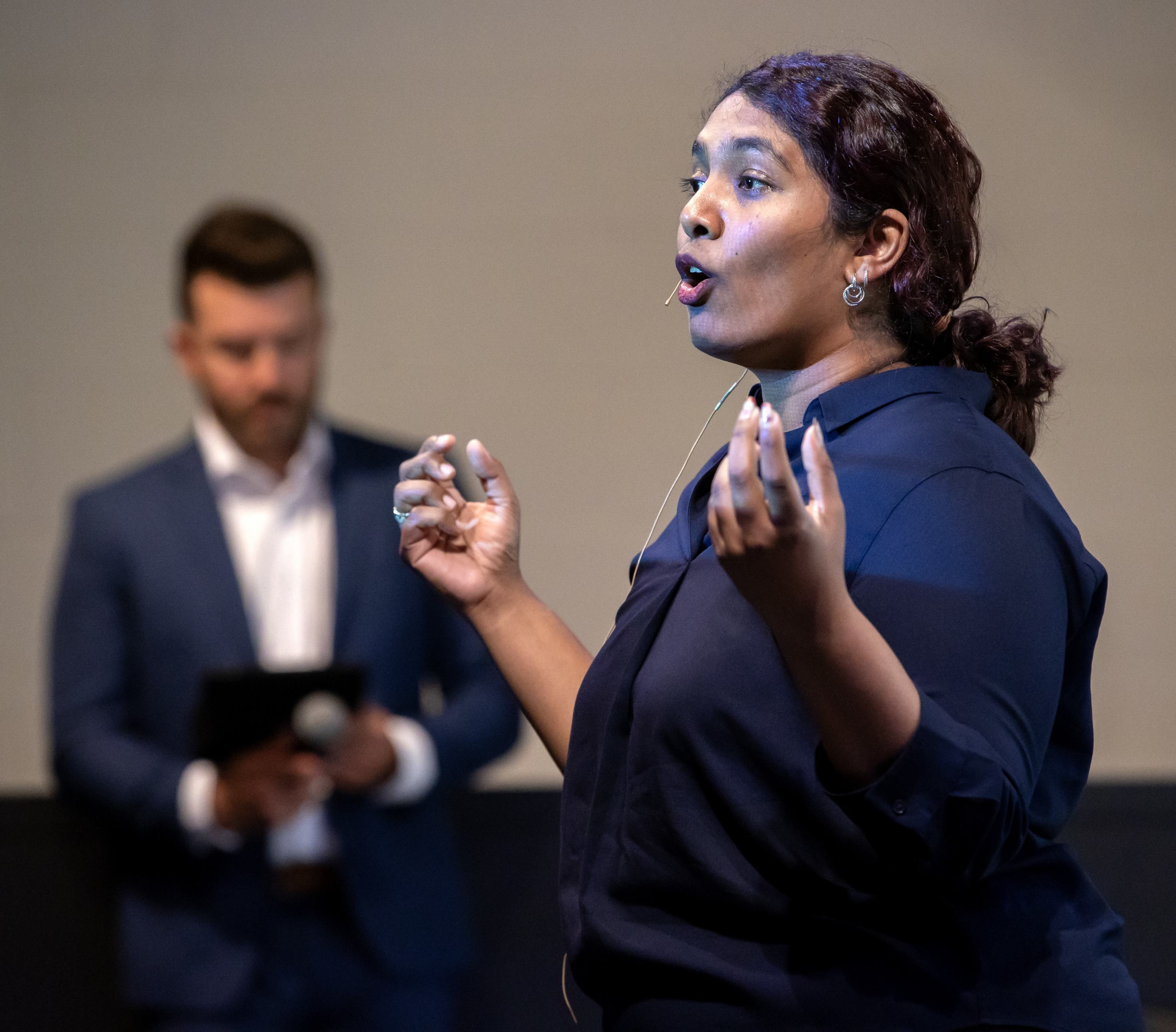 A CSUSB student gives her presentation to judges at the campus competition. 