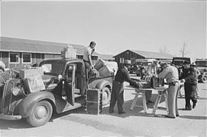 Baggage of Japanese-Americans being inspected as they arrive